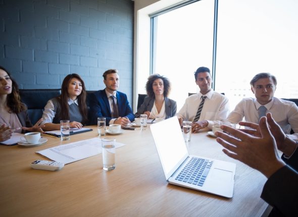 Businesspeople having a discussion in conference room in office